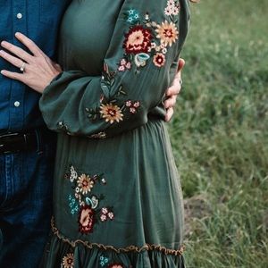 Beautiful dark green, fall dress with multi colored flowers.